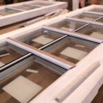 Glass panes inserted on custom wood doors.